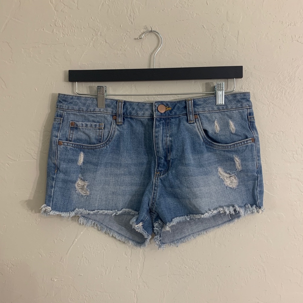 Light blue distressed denim jean shorts.
